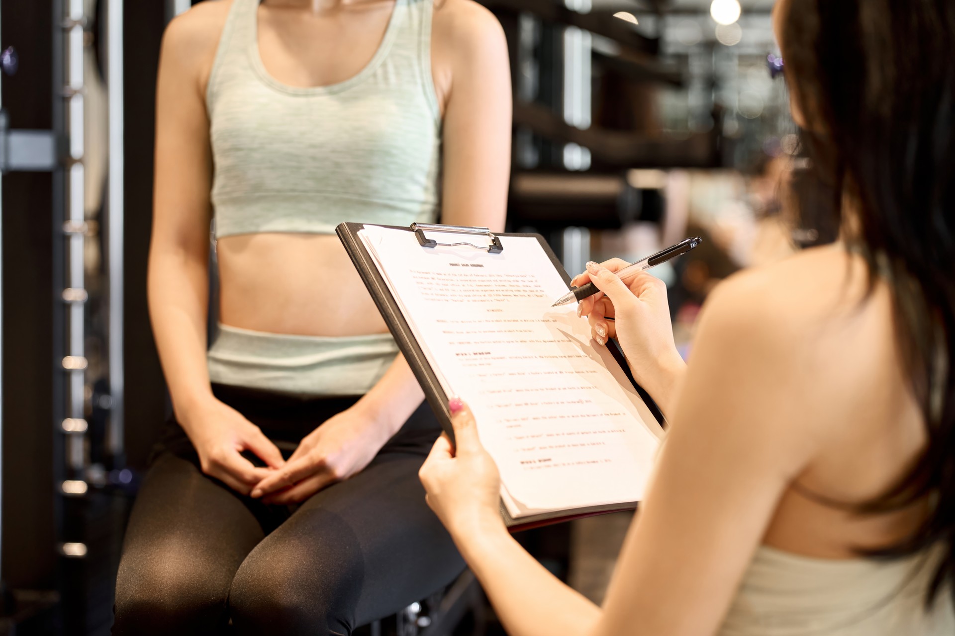 Female trainer giving counseling at the gym